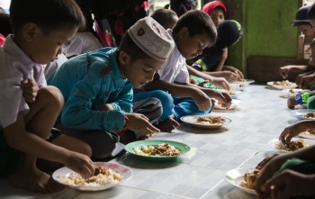 Children in Thailand eating Mary's Meals