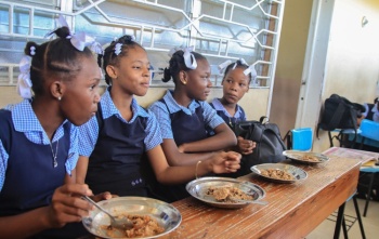 RS26721_Girls with food in class_0.jpg