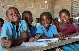 Efigênia in class with school friends 