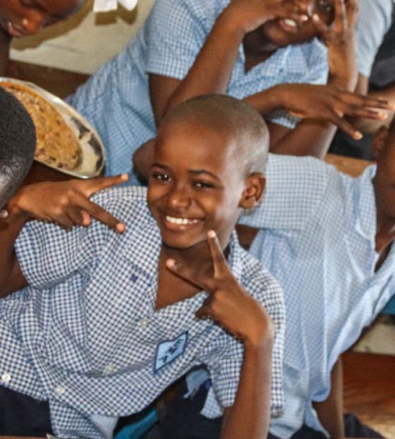 RS26717_Children with food in class.jpg