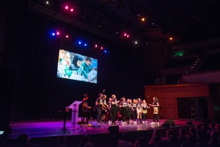 Children on a stage during a concert