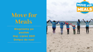 People standing on the beach with backs to the camera