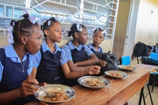 RS26721_Girls with food in class_0.jpg